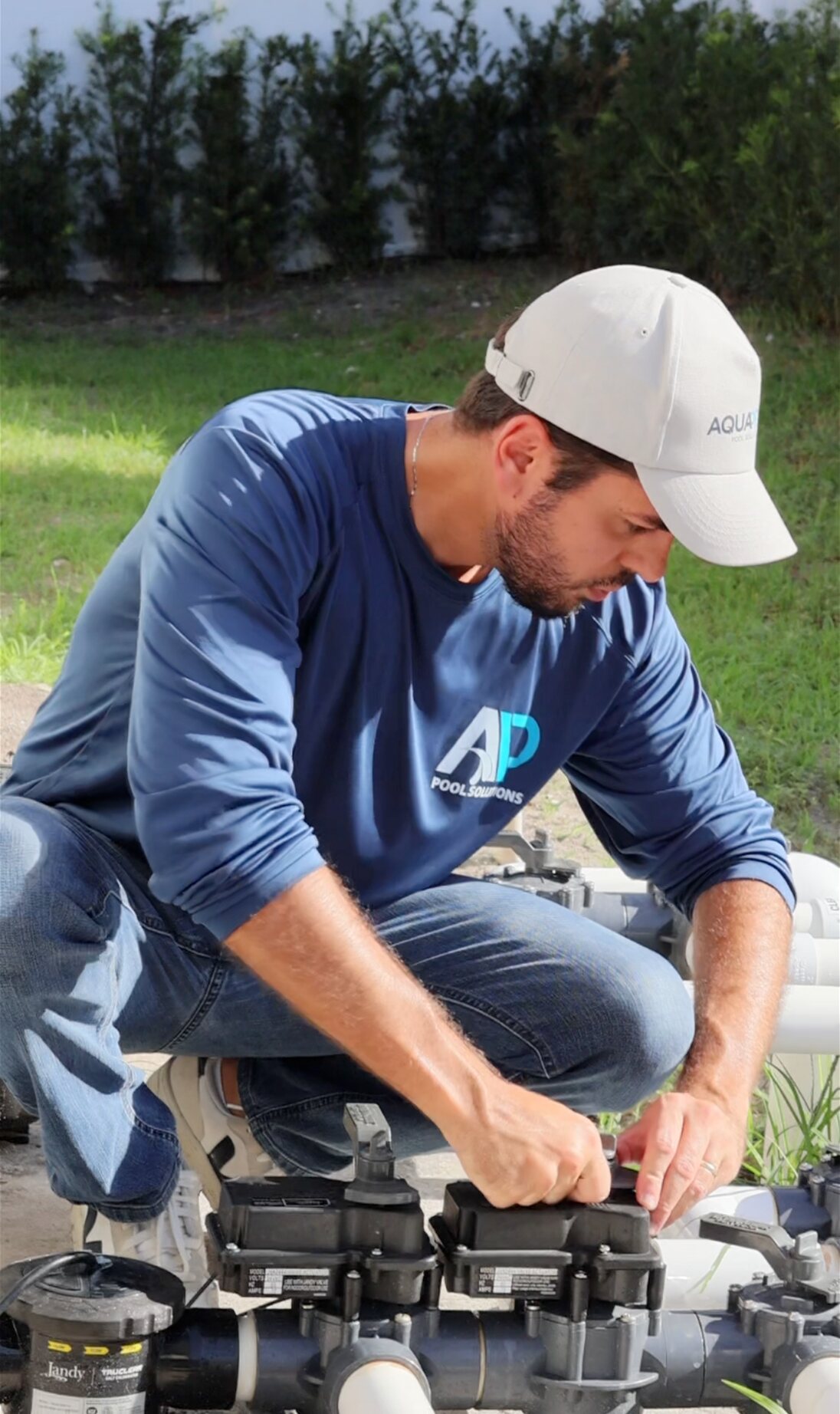 AquaPrime pool specialist servicing a backyard pool in South Florida